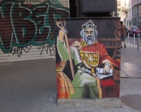 A street electrical box decorated with a picture of a medieval monarch, probably the Bulgarian tsar Simeon I the Great